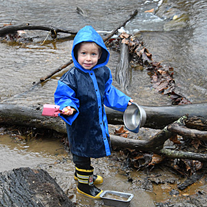 Boy playing in creek
