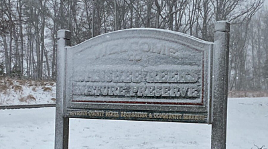 Snow-covered Banshee Reeks sign