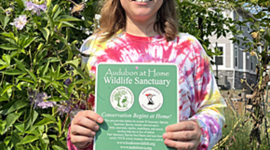 Zuzana with Wildlife Sanctuary sign