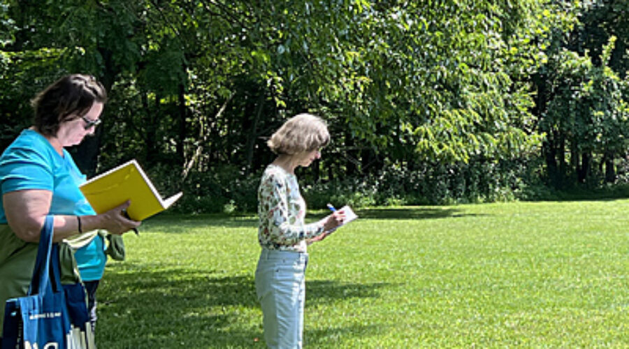 Two participants writing and thinking