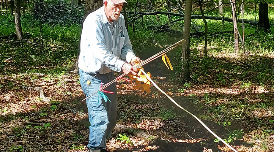 Volunteer measuring for fence