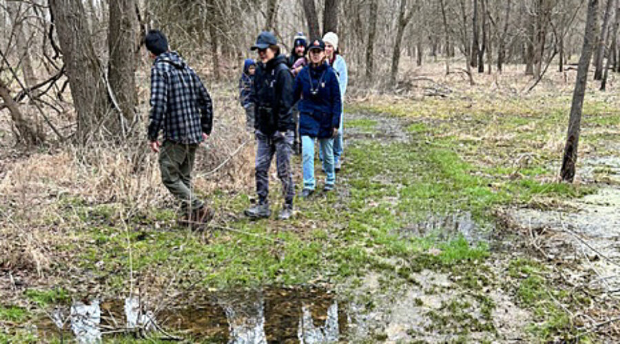 Birders on muddy trail at Banshee Reeks.
