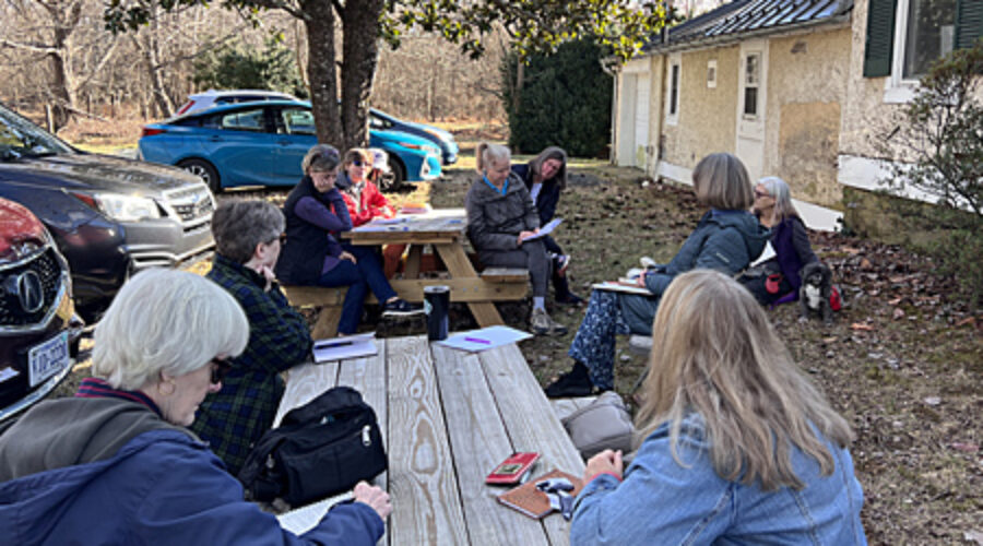 Workshop participants at picnic tables
