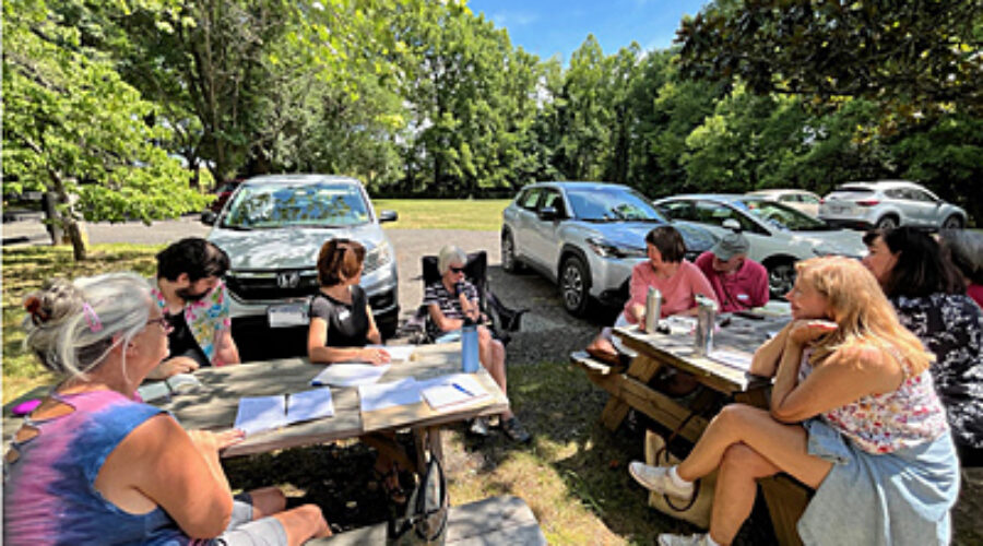 Writing in nature group outside gatehouse