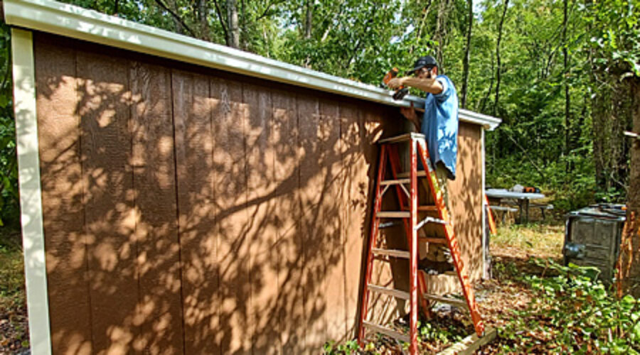 Volunteer on ladder