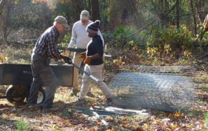 Unloading fencing materials near vernal pool